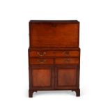 A George III mahogany and line inlaid secretaire cabinet