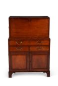 A George III mahogany and line inlaid secretaire cabinet