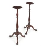 A pair of George II mahogany torchère stands