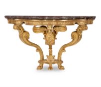 A carved giltwood serpentine console table