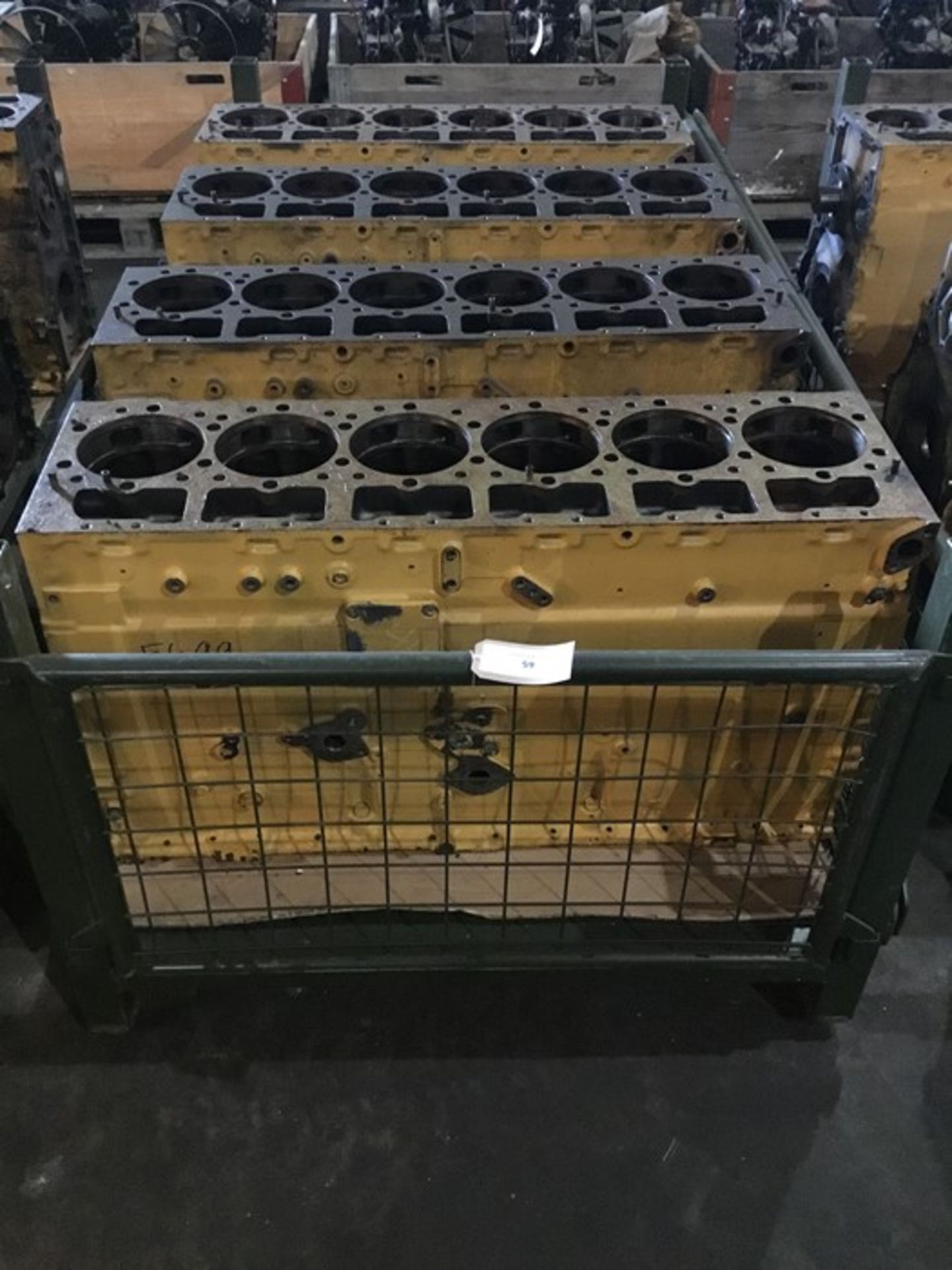 Stillage containing qty 3 Caterpillar 3406E 6cyl Bare block Serial 1DZ05560,Serial 1DZ05250 Serial
