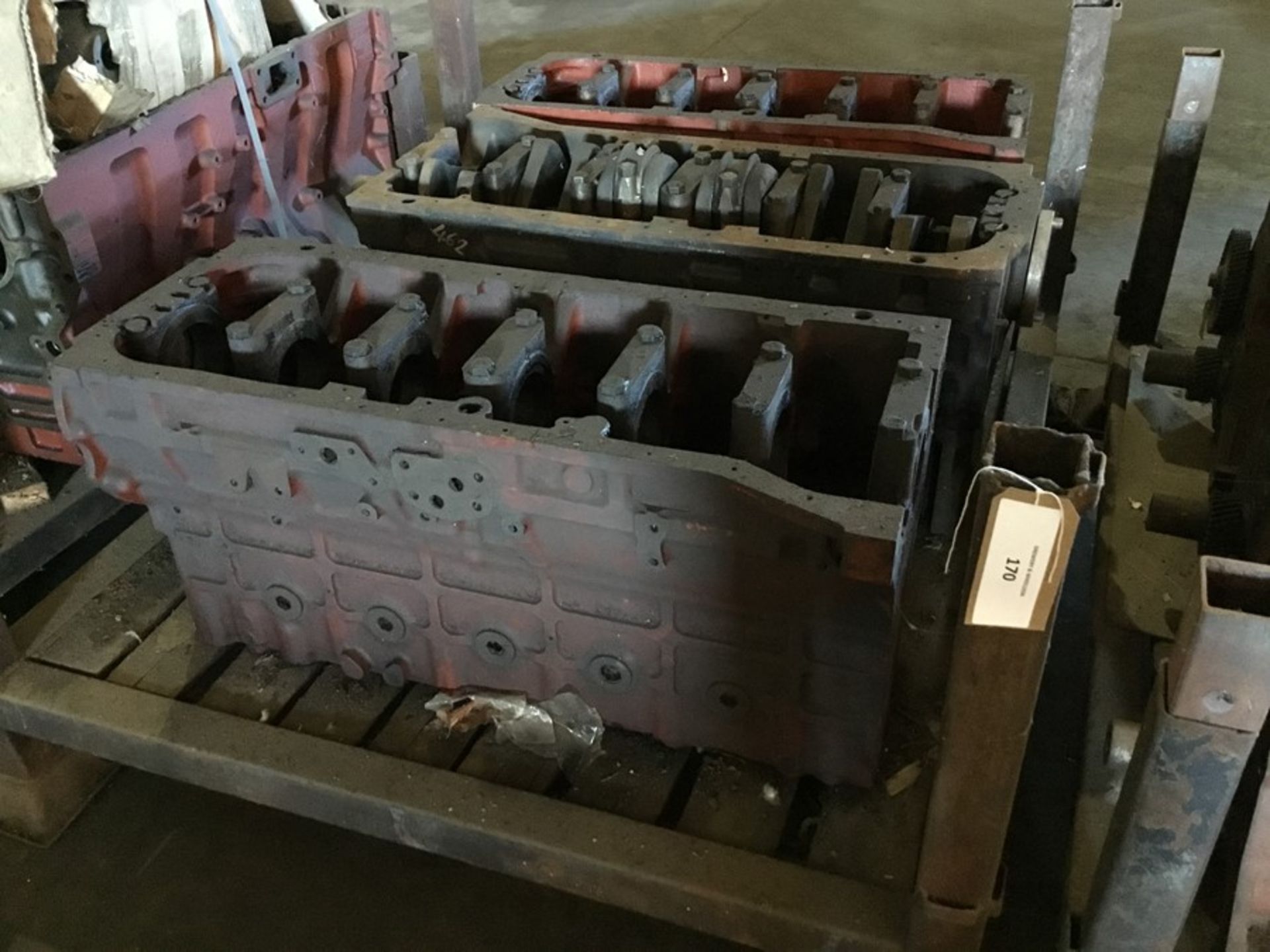 Stillage containing qty1 Bedford 500 short motor and qty2 Bedford 500 engine blocks