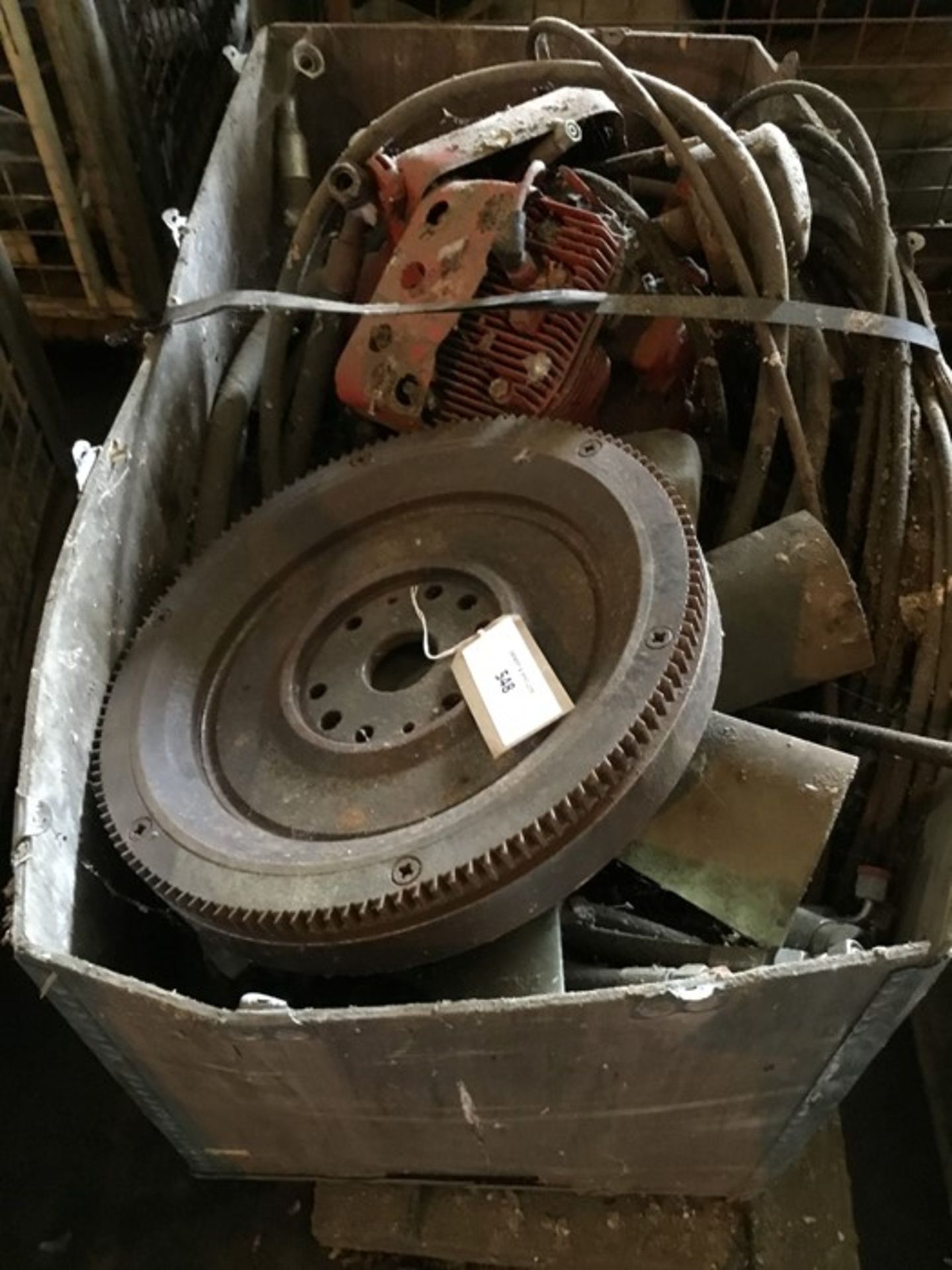 Box containing stripped Kohler petrol engine, steel rope, flywheel and qty of misc. hoses