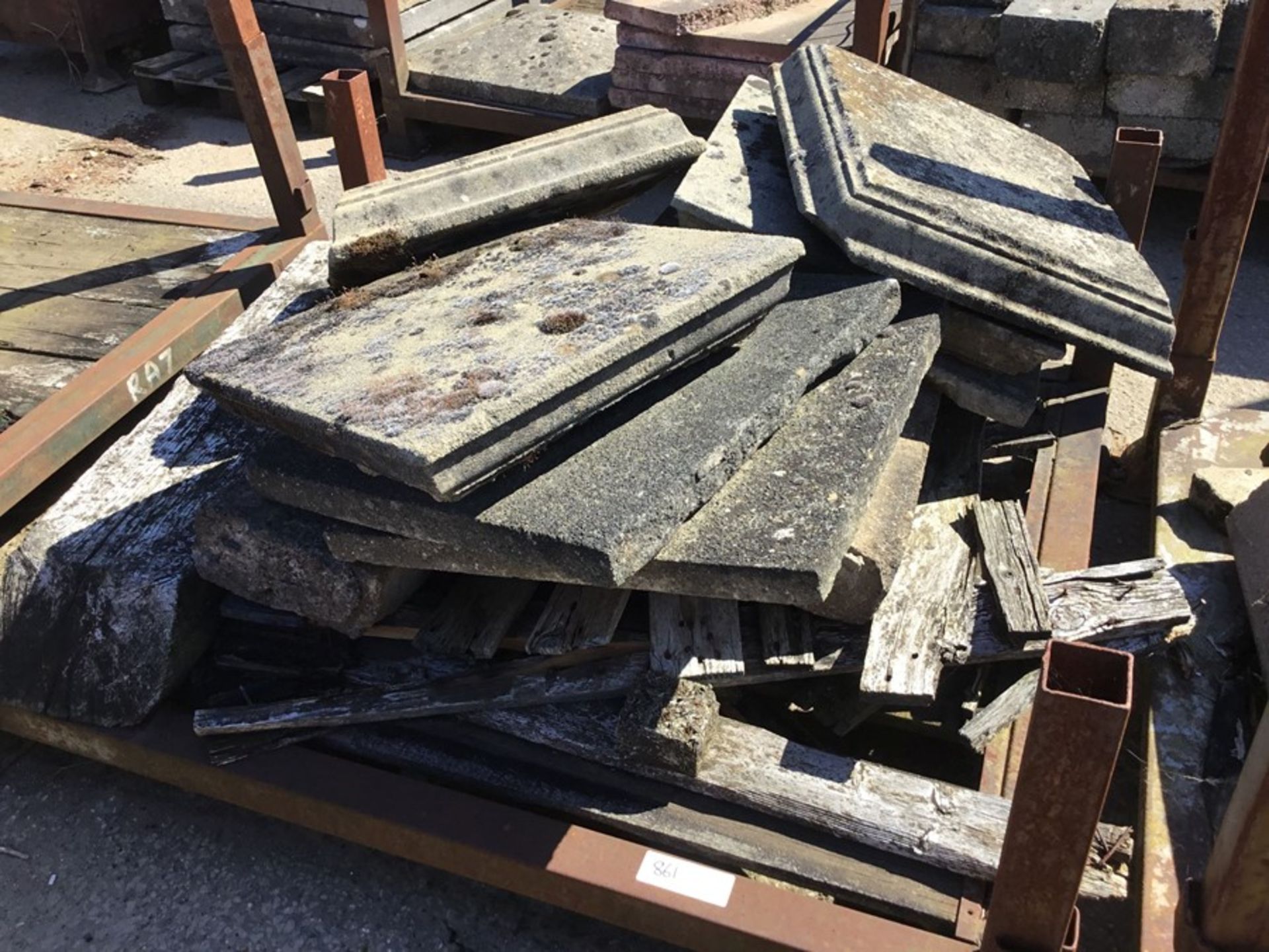 Stillage containing misc. Sandstone plinths and slabs