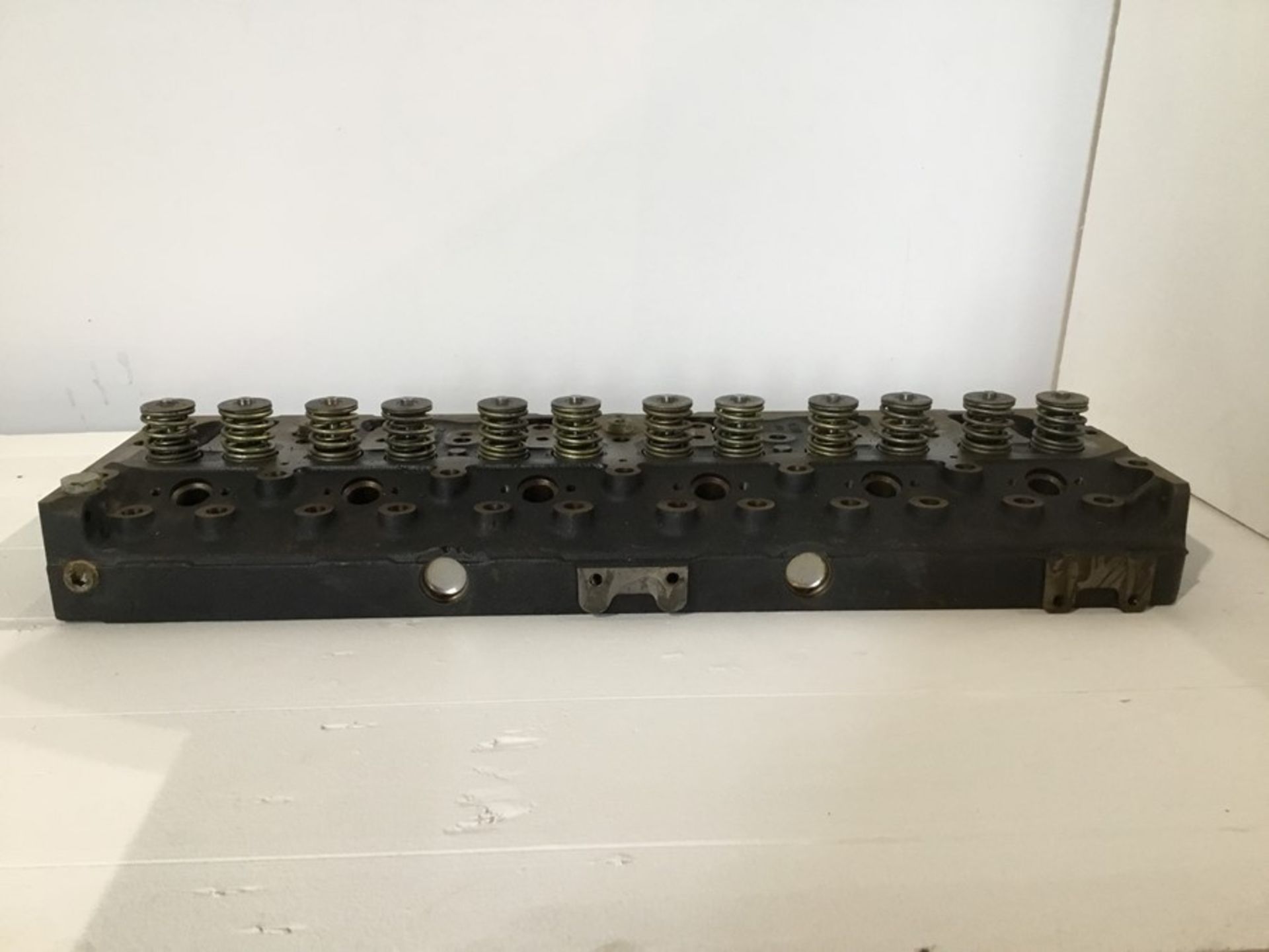 Stillage containing 6 Perkins cylinders heads cast no3711603A and qty 4 Perkins cylinder cast no - Image 9 of 36