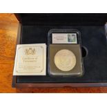 A cased US Philadelphia 1921 Morgan Dollar.