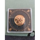2015 uncirculated full gold sovereign in case and purse.