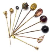 Victorian and later gold and metal mounted stick pins, including cabochon garnet and diamond set,