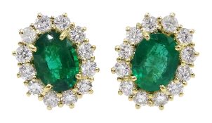 Pair of 18ct gold Zambian emerald and diamond cluster stud earrings, stamped 750,