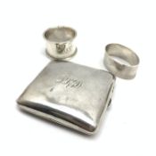 Silver cigarette case engraved with initials Birmingham 1905, and two silver serviette rings 5.