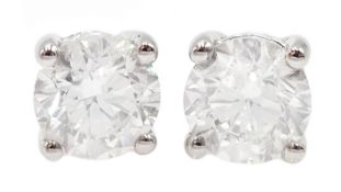 Pair of 18ct white gold diamond stud earrings stamped 750, diamond total weight 2.