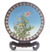Large late 19th Century Japanese cloisonne charger decorated with a spray of flowers on a blue