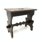 Italian walnut stool, moulded rectangular top with crescent shaped pierced carry handle,
