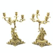 Pair of ormolu four light candelabra with foliate branches supported by classical male and female