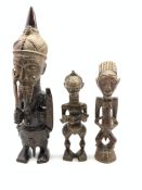 African Benin style carved wooden figure holding a sword and shield H45cm and two smaller African