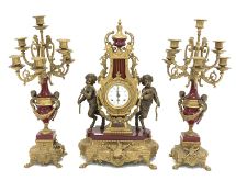 20th century Empire style brass clock garniture, with red enamel detail,