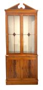20th century mahogany bookcase on cupboard, broken arch pediment above astragal glazed doors,