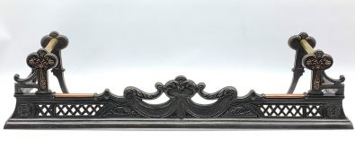 Victorian style cast iron and brass mounted fire curb with integral impalement rests,