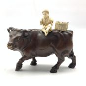 Late 19th century Japanese carved wood figure of a Buffalo with an ivory figure of a child seated