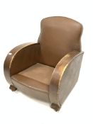 Art Deco oak framed armchair, upholstered in brown faux leather, raised on castors,
