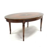 Regency design mahogany coffee occasional table of oval form, with floral painted panel,
