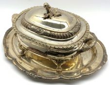 Silver-plated two handled tureen and cover with bud lift and paw feet W42cm and an oval tray