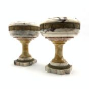 Pair of Neo Classical veined white marble urns decorated with a metal band of classical drapes on a