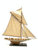 Wooden model Yacht on an oblong stand,