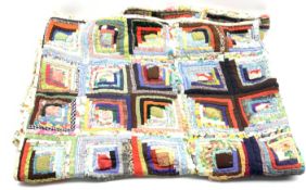 Patchwork quilt of geometric design with floral back,
