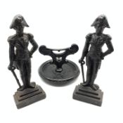 Pair of andirons with standing figure of Napoleon and a painted cast iron boot scraper