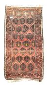 Old Afghan rug, repeating field and border,