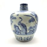 Chinese provincial jar of circular form, decorated in blue and white with birds and flowers,