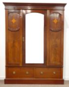 Edwardian inlaid mahogany wardrobe, arched bevelled glazed central door,