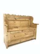 Early 20th century pine box settle, shaped cresting rail, panelled back,