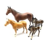 Beswick Racehorse in brown matt No. 701, brown Foal with head down No.