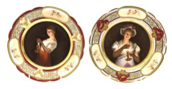 Pair of early 20th Century Vienna style porcelain plates each decorated with a female figure
