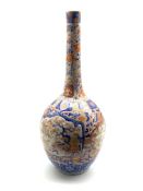 Large 19th Century Imari bottle shape vase with panels of landscapes and flowers in orange and blue