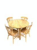 Contemporary solid oak circular dining table raised on square tapered supports (110cm x 110cm,