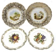 Pair of 19th Century porcelain plates painted with landscape panels within heavily gilded border