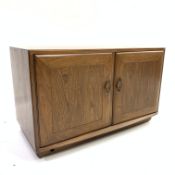 Ercol elm two door side cabinet, fitted with single adjustable glass shelf, W91cm, H56cm,