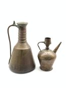 Turkish planished copper water carrier with loop handle H46cm and a copper ewer with engraved