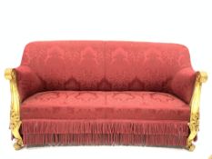 19th century gilt wood and gesso upholstered three seat sofa, covered in red damask,
