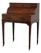 Edwardian mahogany cylinder front writing desk with three drawers,