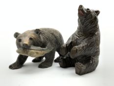 Black Forest carved wood bear with a fish L23cm and another of a seated bear Condition