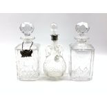 Pair of Edinburgh crystal cut glass decanters and a glass claret jug with three loop handles and
