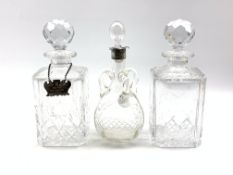 Pair of Edinburgh crystal cut glass decanters and a glass claret jug with three loop handles and