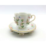 Meissen cabinet cup and saucer of lobed oval design decorated with applied and painted flowers and