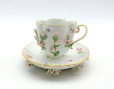 Meissen cabinet cup and saucer of lobed oval design decorated with applied and painted flowers and