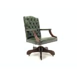 Modern mahogany open arm office chair, upholstered in deep buttoned green leather,