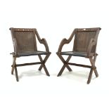Pair of Victorian oak Glastonbury chairs, with pierced Gothic detail, panelled backs and seats,